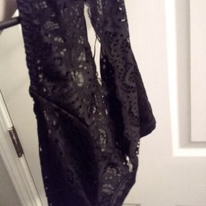 Body Rage black lace bralette and shiny black booty shorts